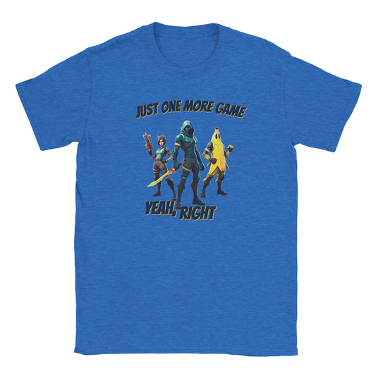 Light blue t-shirt. In the center are fully colored three video game characters. In the center is a powerful ninja with a glowing yellow sword, to his right is a woman holding a rifle and has cat ears on her head. 

To his left is a person in a yellow banana costume, holding a fist partially up.

Above are the words, "Just one more game" in dark blue with a light yellow drop shadow.

Underneath are the words, "Yeah, right" in dark blue and a light yellow drop shadow.